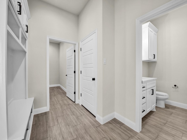 mudroom with light hardwood / wood-style floors