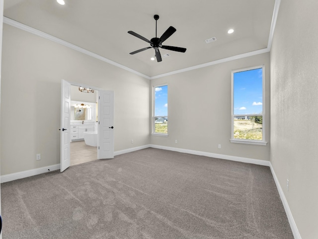 unfurnished bedroom featuring multiple windows and crown molding