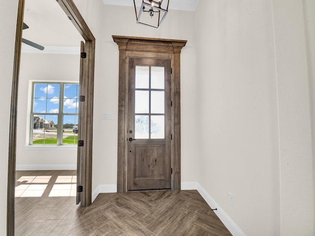 doorway to outside featuring parquet floors and a wealth of natural light