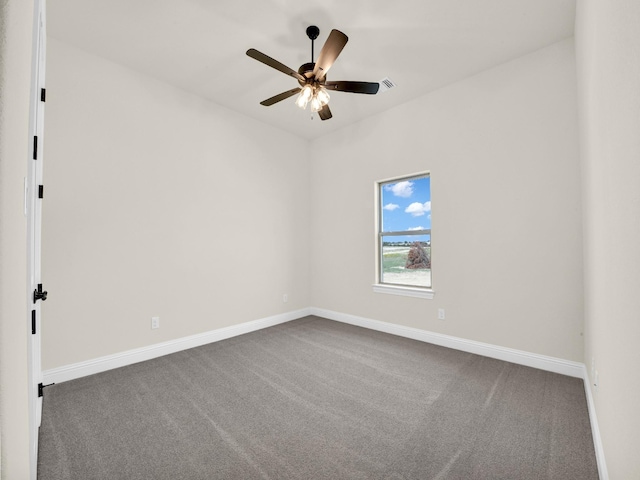 empty room featuring carpet floors and ceiling fan