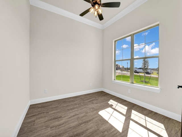 empty room featuring ceiling fan, dark wood-type flooring, and ornamental molding