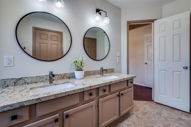 bathroom featuring tile patterned floors, vanity, and walk in shower