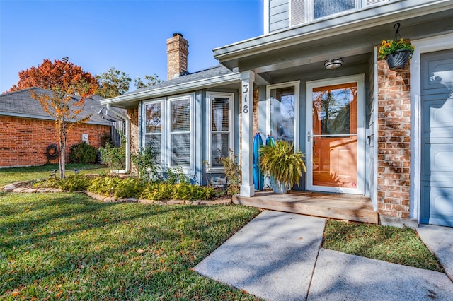 entrance to property with a yard