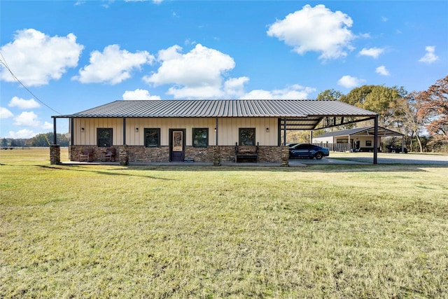 view of front facade with a front yard and a carport