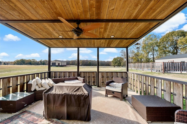 view of patio with a wooden deck, ceiling fan, and area for grilling