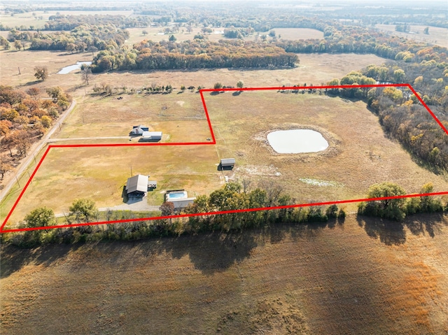 birds eye view of property featuring a rural view