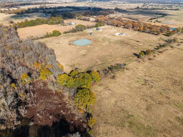 birds eye view of property with a rural view