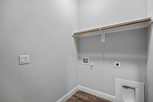 laundry room with hookup for an electric dryer, hookup for a gas dryer, dark wood-type flooring, and washer hookup