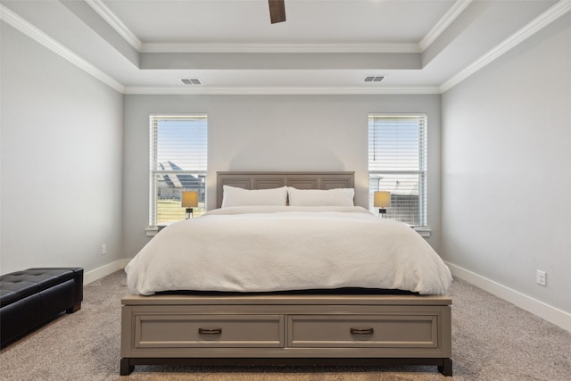 bedroom with light colored carpet, multiple windows, and ornamental molding