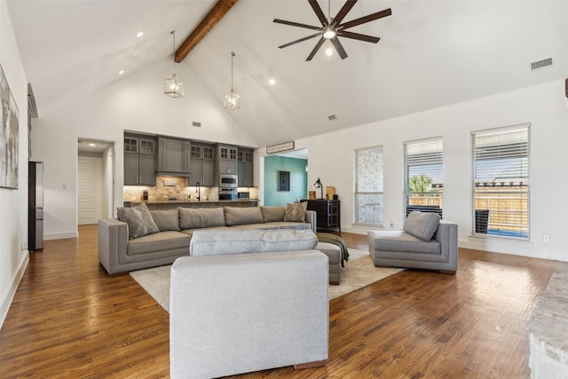 living room featuring ceiling fan, beamed ceiling, high vaulted ceiling, and dark hardwood / wood-style floors