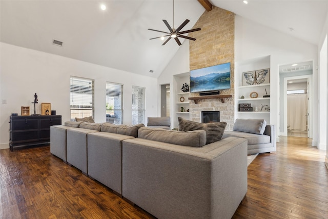 living room with beamed ceiling, dark hardwood / wood-style flooring, built in features, and high vaulted ceiling