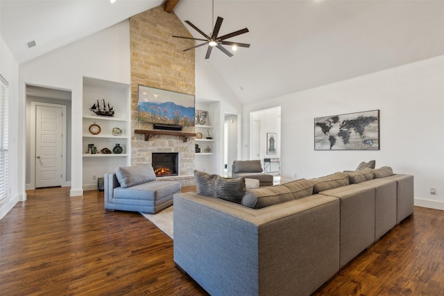 living room with built in shelves, dark wood-type flooring, beam ceiling, high vaulted ceiling, and a fireplace