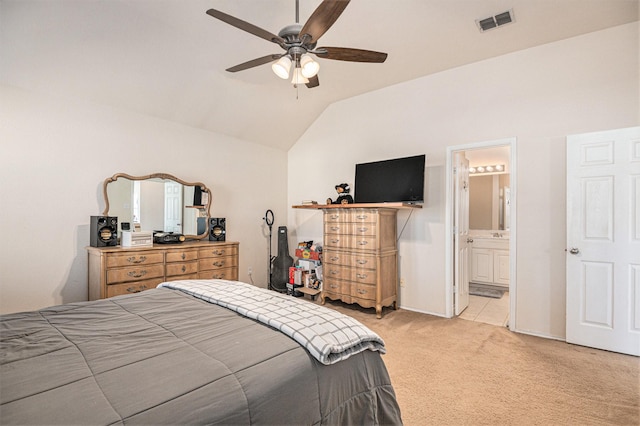 carpeted bedroom with ensuite bathroom, ceiling fan, and lofted ceiling