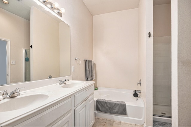 bathroom featuring tile patterned flooring, vanity, and plus walk in shower