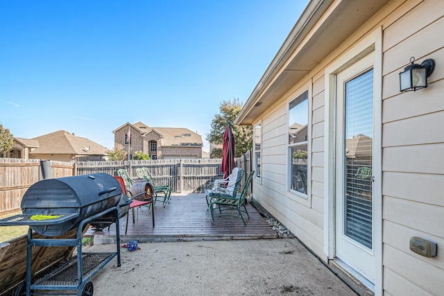 view of patio featuring area for grilling and a wooden deck