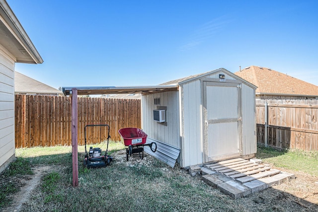 view of outdoor structure with a yard and cooling unit