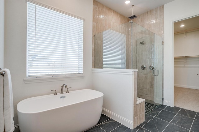 bathroom featuring tile patterned floors and plus walk in shower