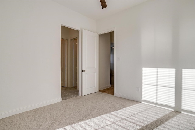 unfurnished room with light colored carpet