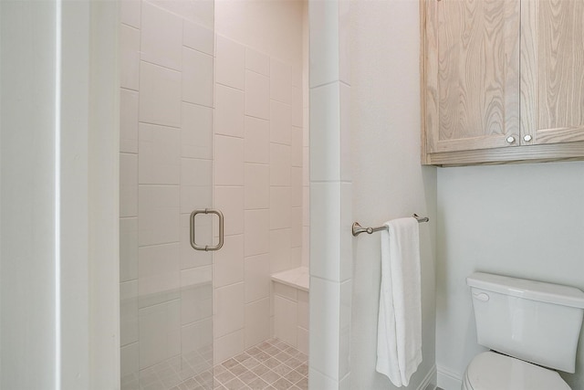 bathroom with toilet and walk in shower