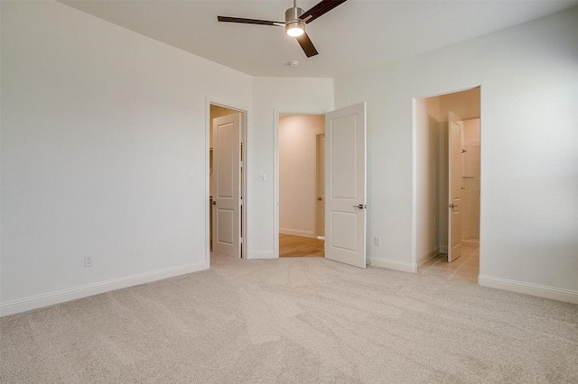 unfurnished bedroom featuring ceiling fan and light colored carpet