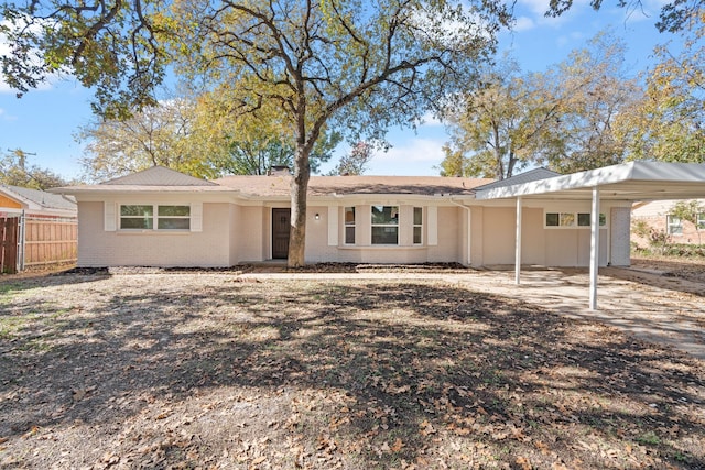 view of front of home with a carport