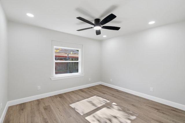 empty room featuring light wood-type flooring and ceiling fan