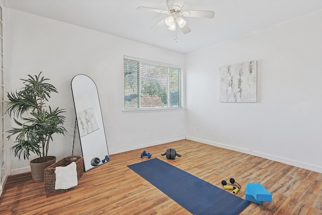 exercise area with hardwood / wood-style flooring and ceiling fan