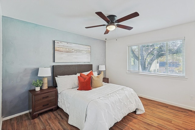 bedroom featuring hardwood / wood-style floors and ceiling fan