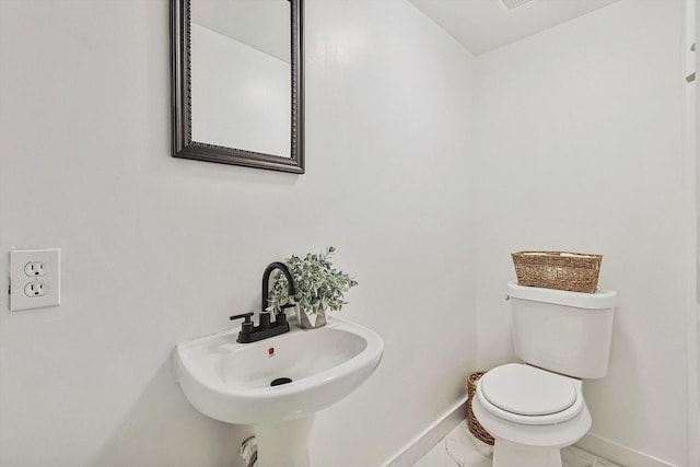 bathroom with toilet and sink