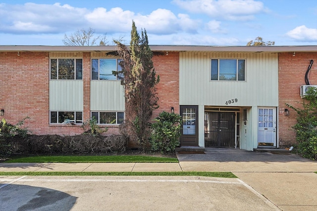 view of front of house featuring brick siding