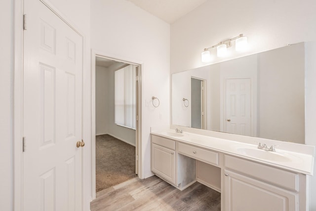 bathroom with vanity and hardwood / wood-style flooring