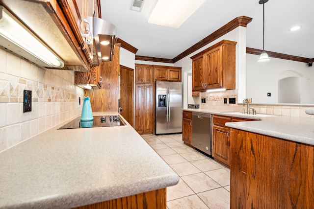 kitchen with pendant lighting, light tile patterned floors, crown molding, sink, and stainless steel appliances