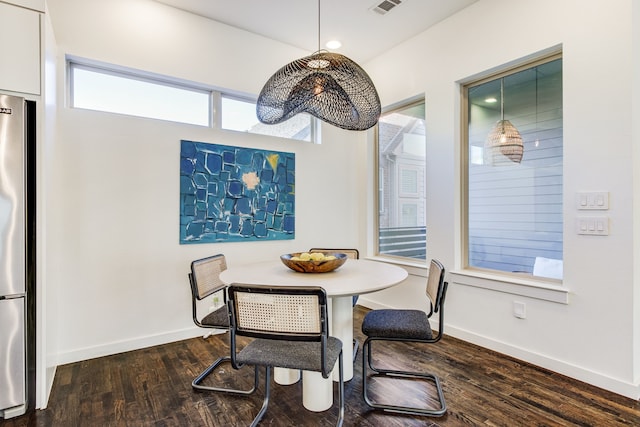 dining area with hardwood / wood-style flooring