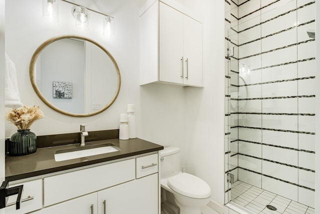 bathroom featuring vanity, toilet, and walk in shower