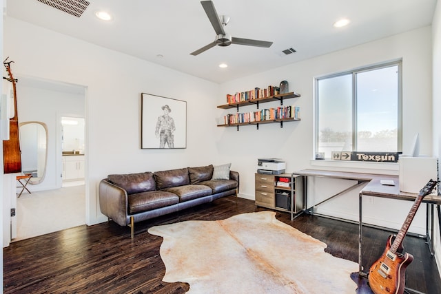 living room featuring ceiling fan and wood-type flooring