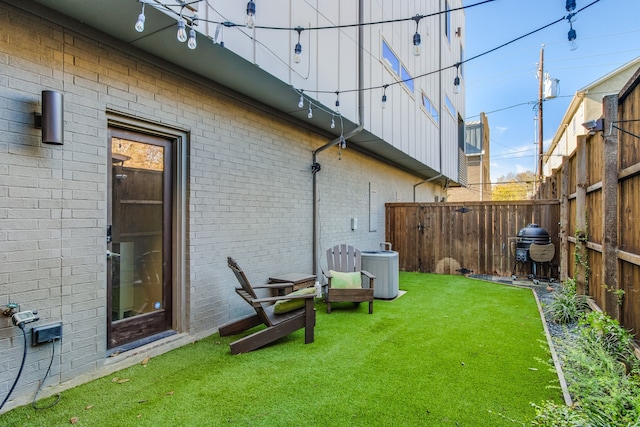 view of yard featuring central air condition unit