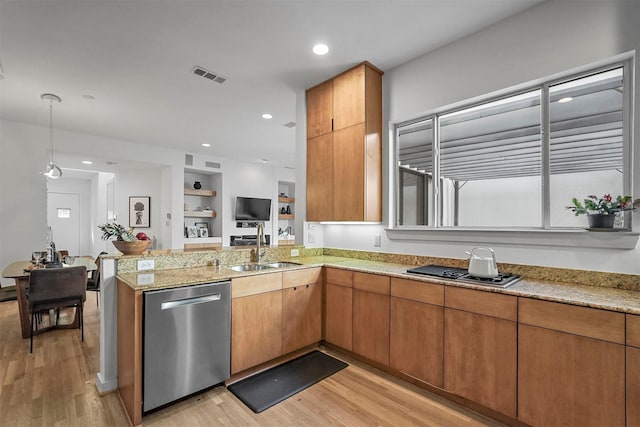 kitchen with built in shelves, sink, stainless steel appliances, and light wood-type flooring