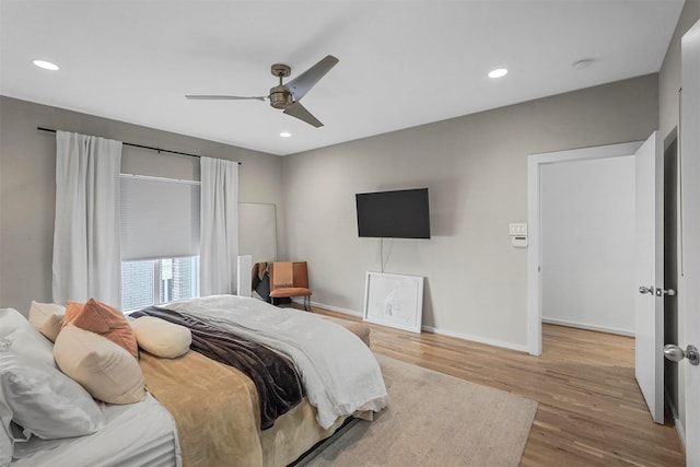 bedroom featuring hardwood / wood-style flooring and ceiling fan