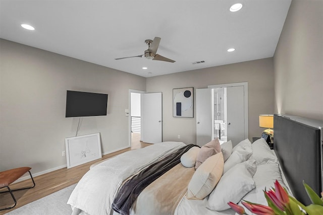 bedroom featuring light hardwood / wood-style flooring and ceiling fan