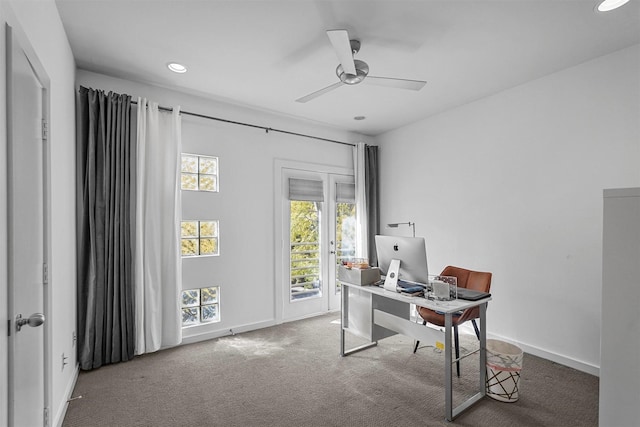 carpeted home office with ceiling fan