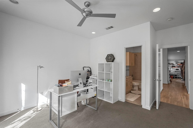 office featuring dark colored carpet and ceiling fan