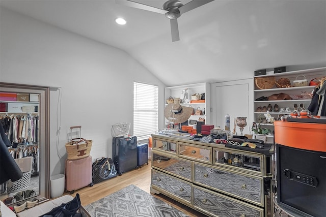 interior space with light hardwood / wood-style floors, ceiling fan, and lofted ceiling