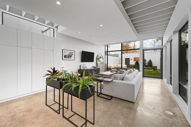 living room featuring floor to ceiling windows