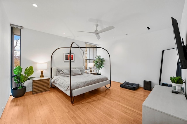 bedroom featuring ceiling fan and light hardwood / wood-style flooring