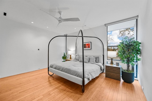 bedroom featuring light wood-type flooring and ceiling fan