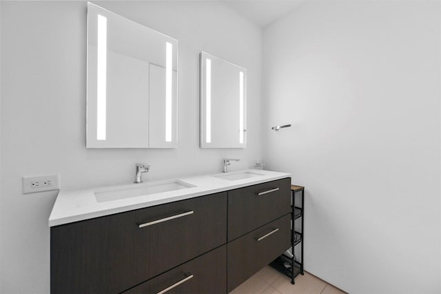 bathroom with tile patterned flooring and vanity