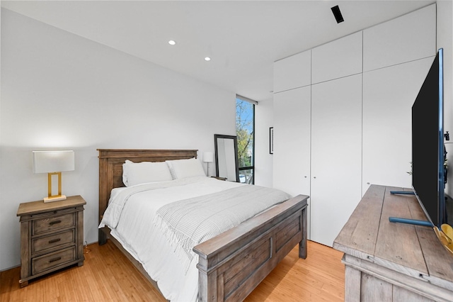 bedroom with light wood-type flooring