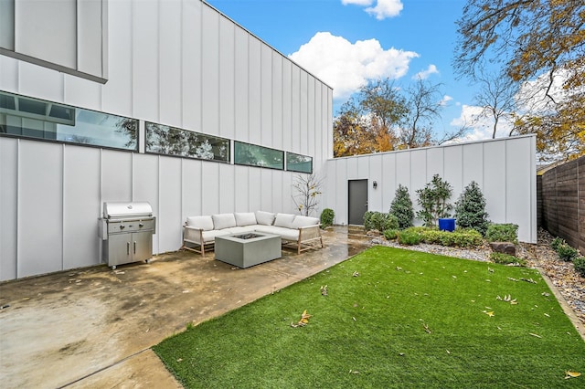 view of yard featuring a patio and an outdoor living space with a fire pit