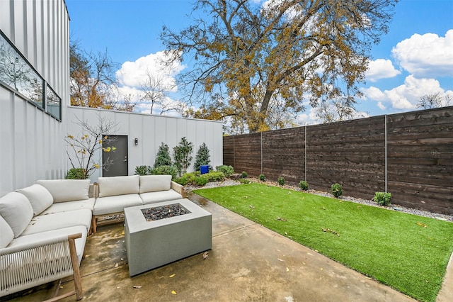 view of patio / terrace featuring an outdoor living space with a fire pit