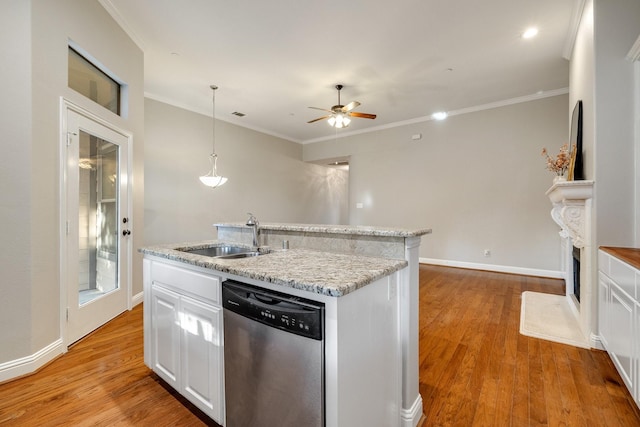 kitchen with dishwasher, light wood-type flooring, white cabinets, and sink